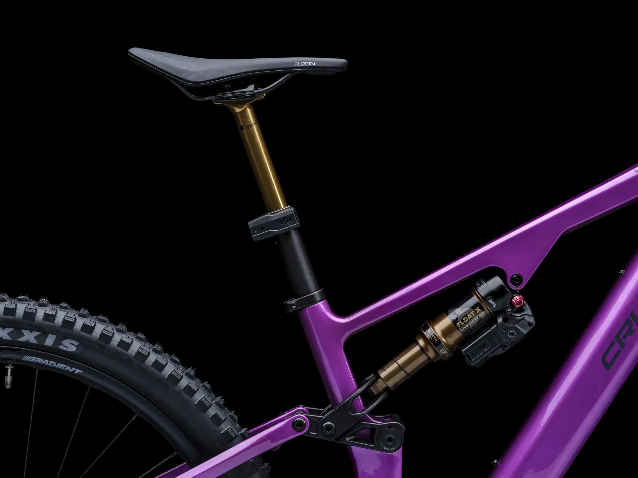 Close-up of Crussis e-Full 12.11 Pro X E-MTB with suspension fork on a black background