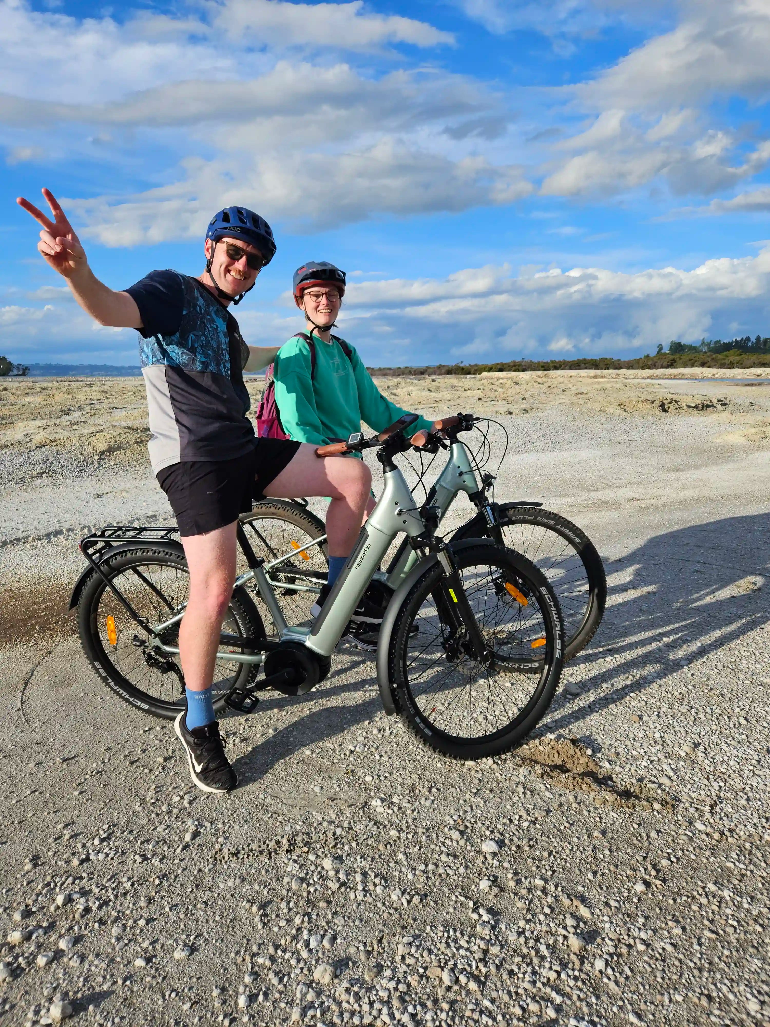 Two people on E-bike rental on a gravel path at Sulphur Point Rotorua