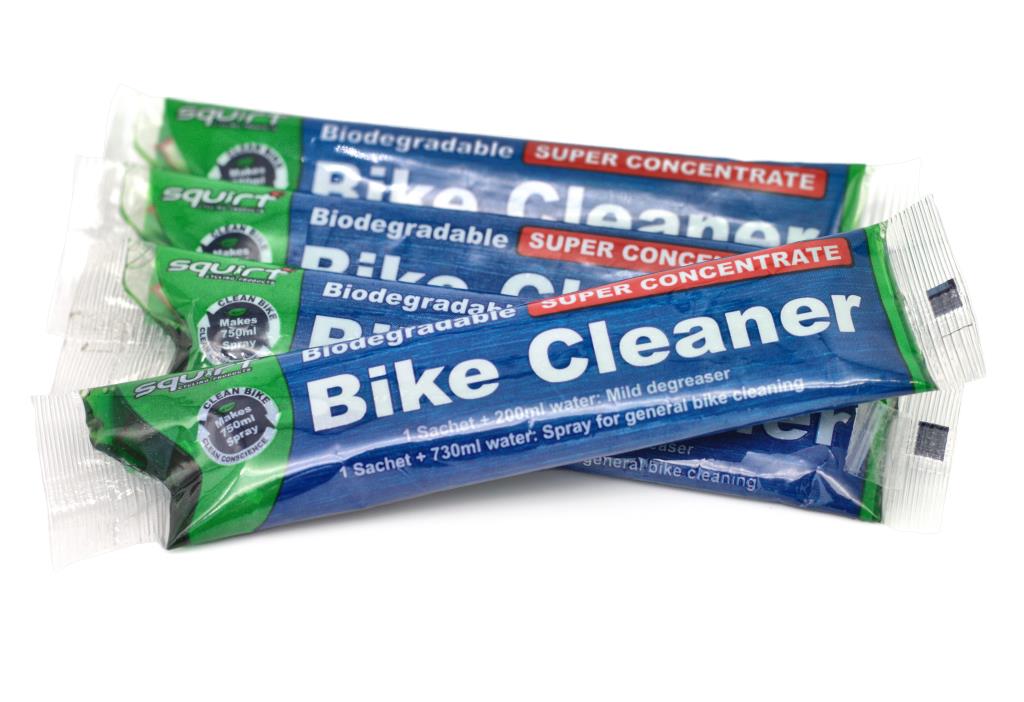 Multiple packages of Squirt Bike Cleaner on a white background