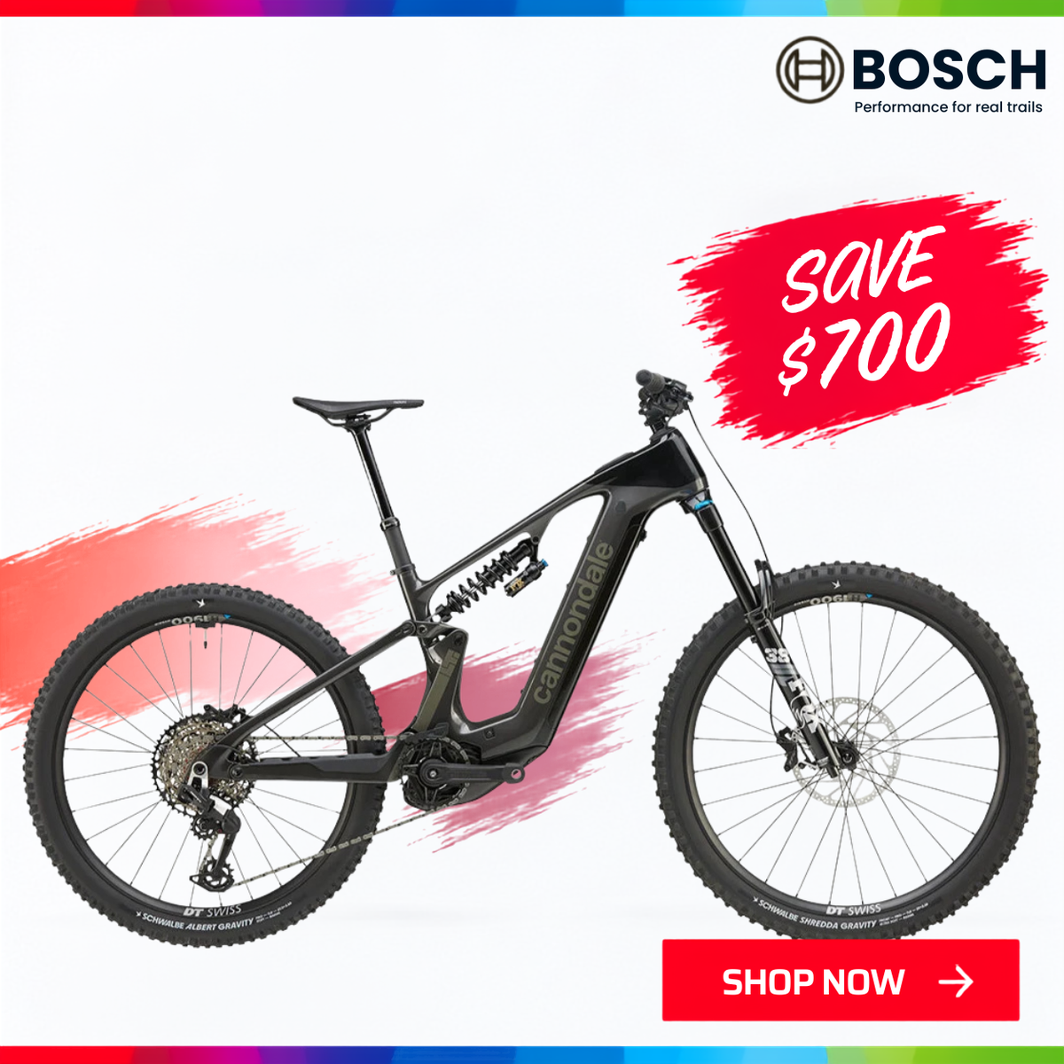 The Cannondale LT1 full-suspension electric mountain bike with a white frame and black components. 'SAVE $700' and 'SHOP NOW' with the Spring into Action sale