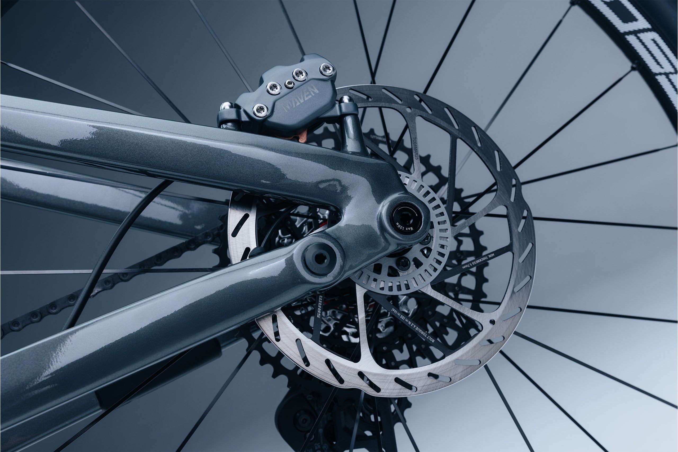 Close-up of Sram Maven disc brake system with a blurred background