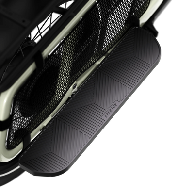 Close-up of a black car step pad aventon abound  on a white background