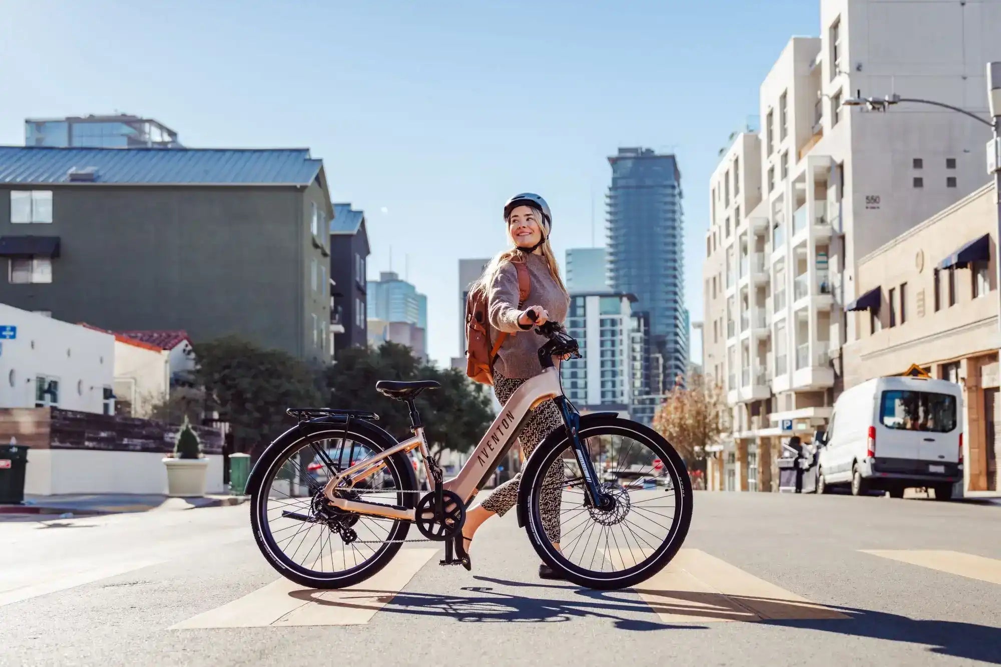 Women walking with Aventon Level 3 Stepthru City E-Bike in city