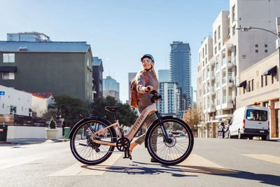 Women walking with Aventon Level 3 Stepthru City E-Bike in city