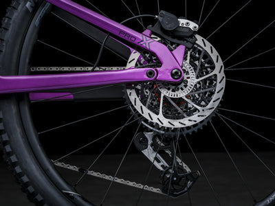 Close-up of Crussis e-Full 12.11 Pro X E-MTB Brakes with a purple frame on a black background