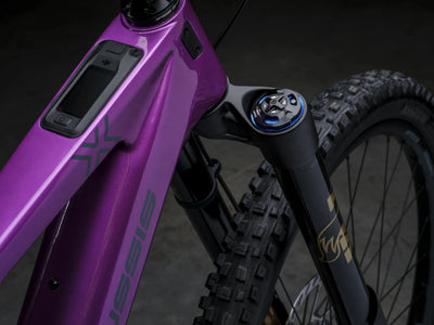 Close-up of Crussis e-Full 12.11 Pro X E-MTB with visible branding on a dark background