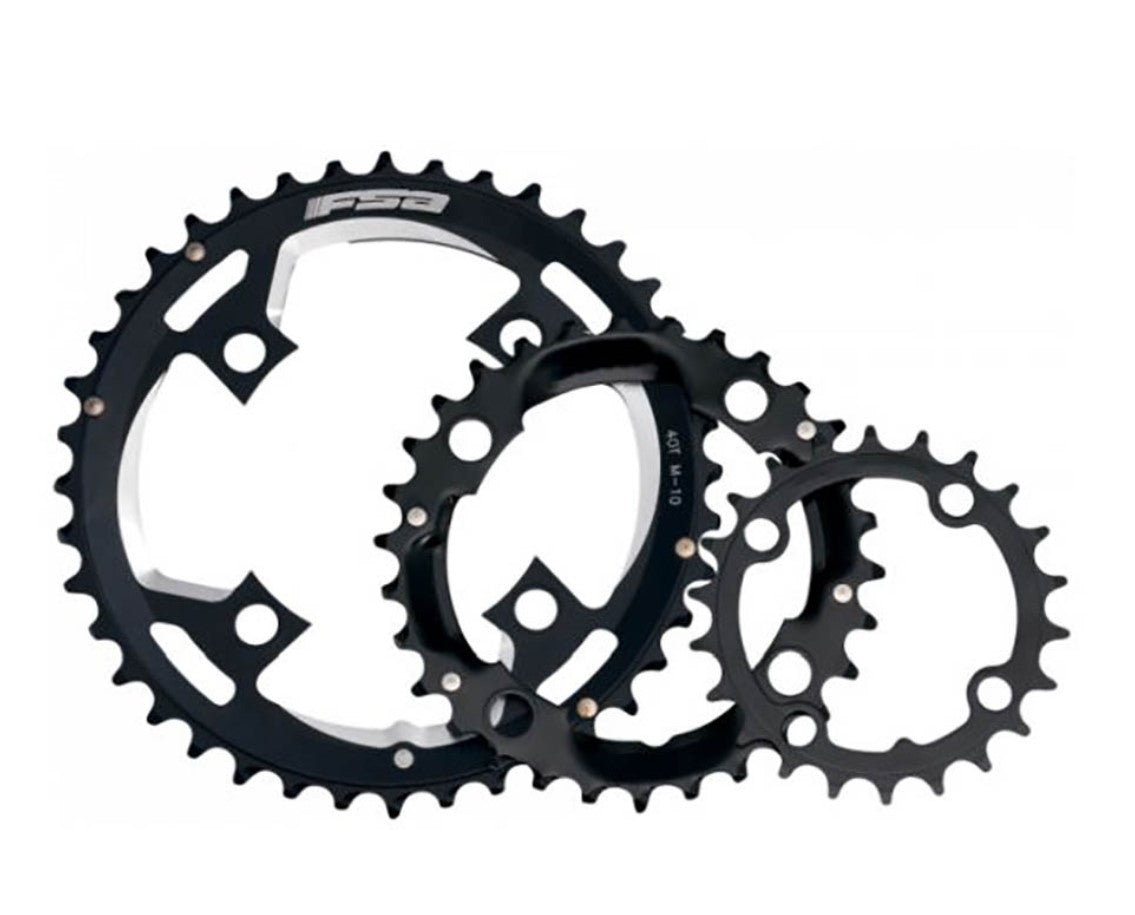 A set of black FSA chainrings designed to fit 104 BCD 4 bolt crank sets, displayed on a white background.