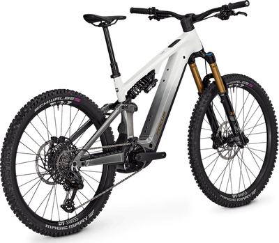 Focus Sam² 6.9 in white/grey electric bicycle on a black stand with a clear background