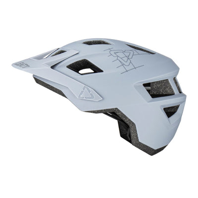 Grey Leatt helmet with black accents on a white background