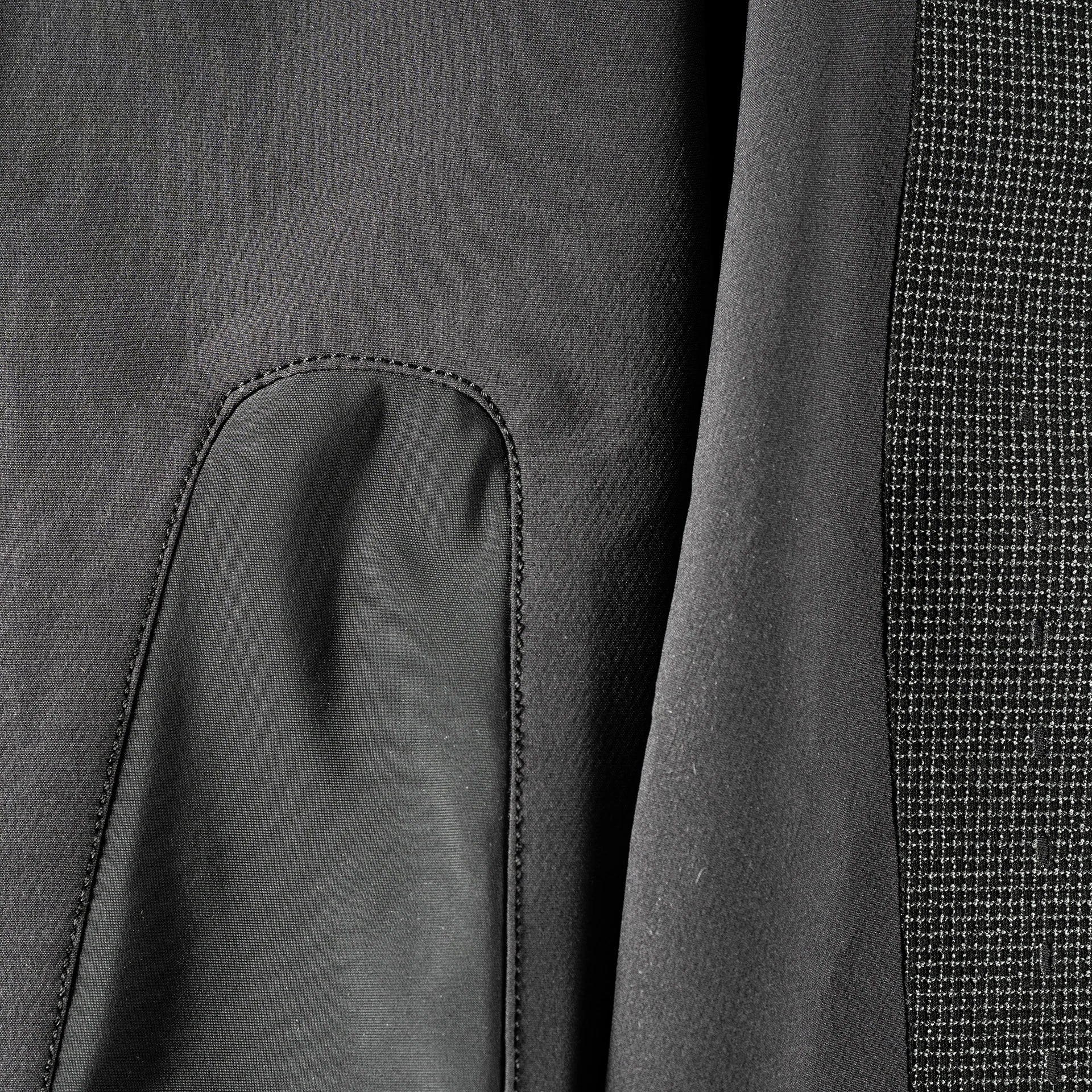 Close-up of a dark gray fabric with textured pattern- Leatt MTB Gravity 3.0 Women