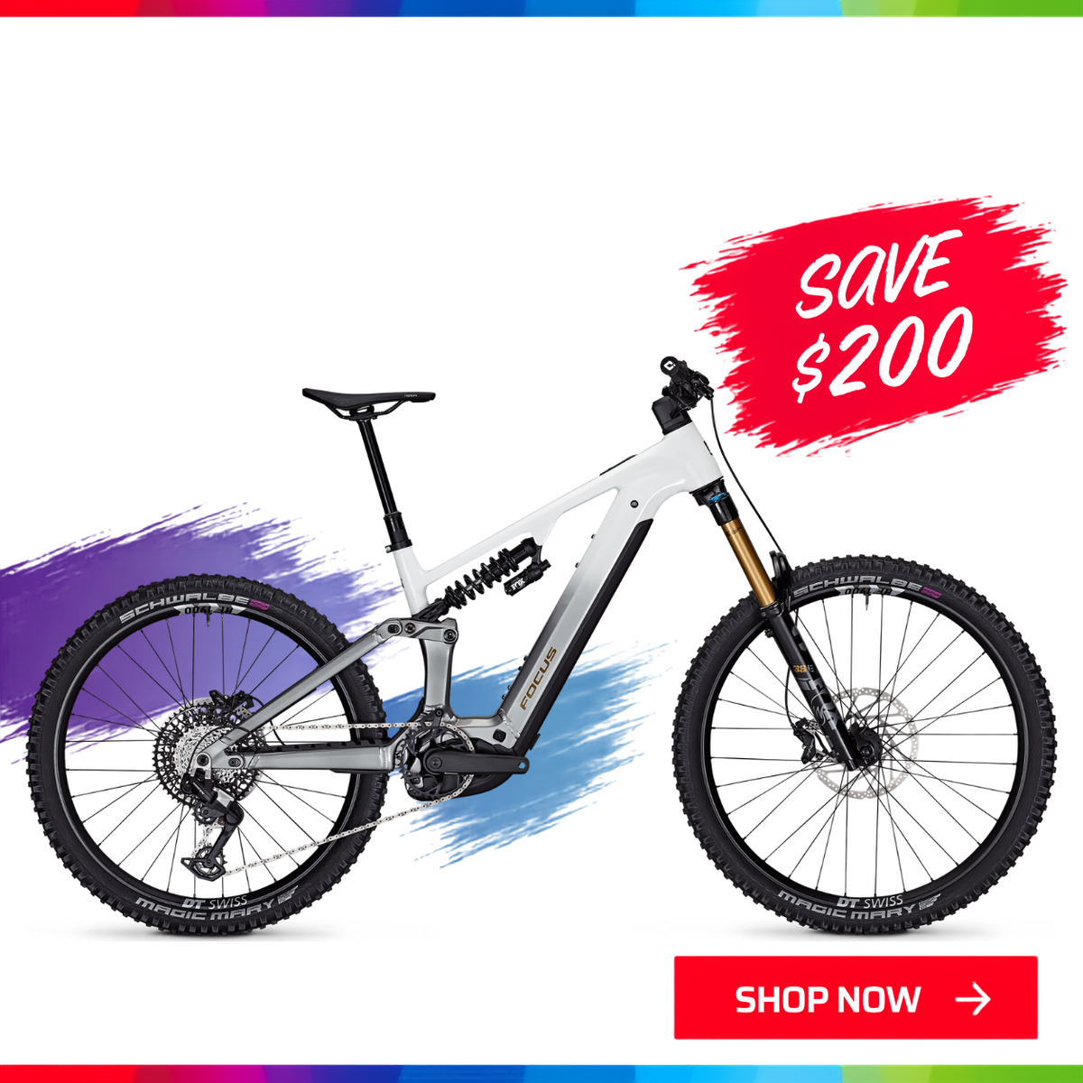The Focus SAM 6.9 full-suspension electric mountain bike with a white frame and black components. 'SAVE $200' and 'SHOP NOW' with the Spring into Action sale