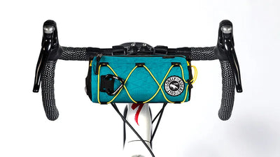Teal bike handlebar bag, Neo Porter coursier,  with visible brand logo on a white background