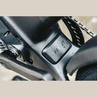 Close-up of Aventon ADV Ebike with 'Aventon' branding on a beige background