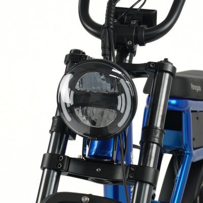 Close-up of Smartmotion Renegade E-Bike headlight and handlebar on a white background