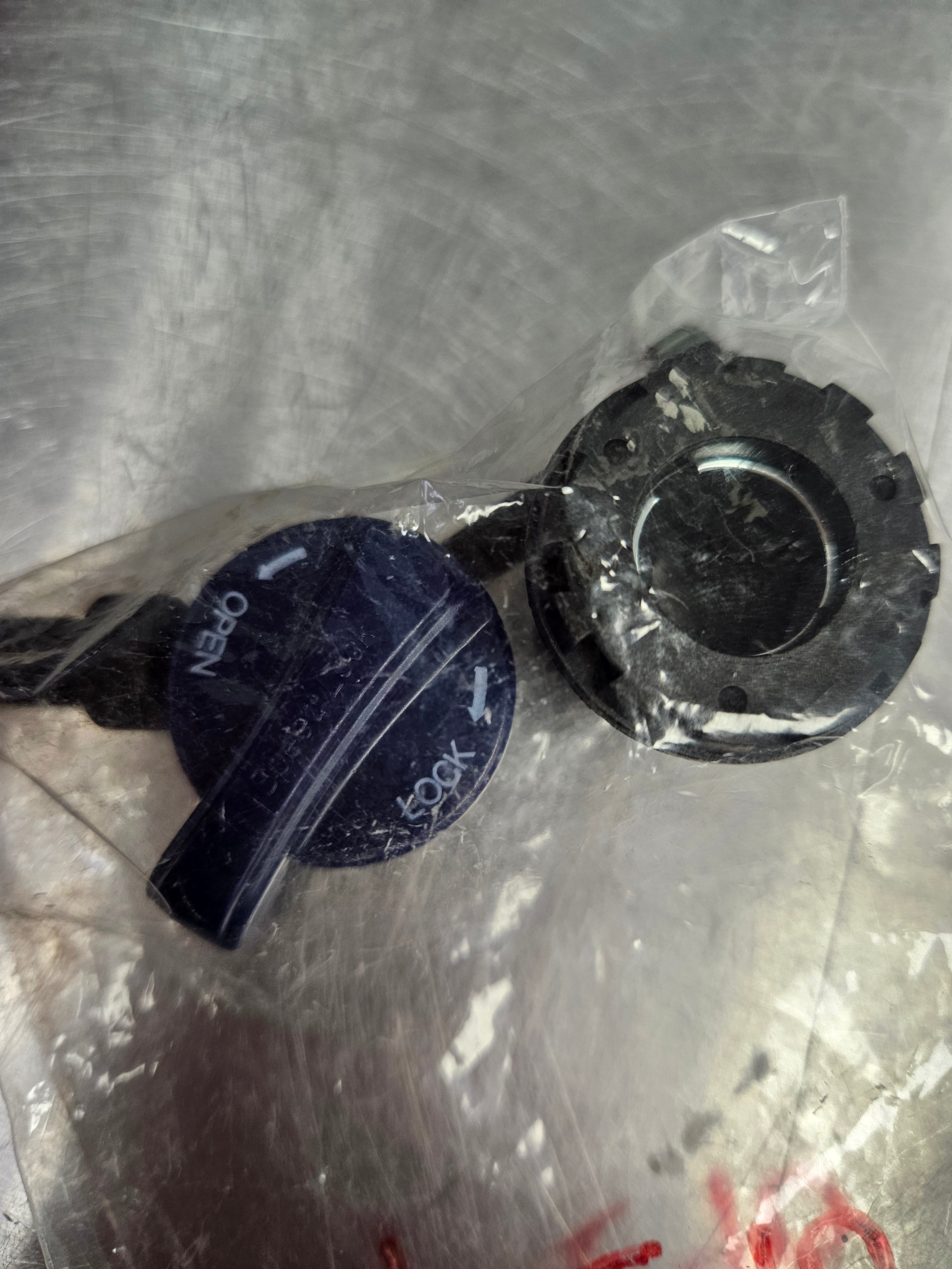 SR Suntour XCT HLO Top Cap, primarily black in color, packaged in plastic.